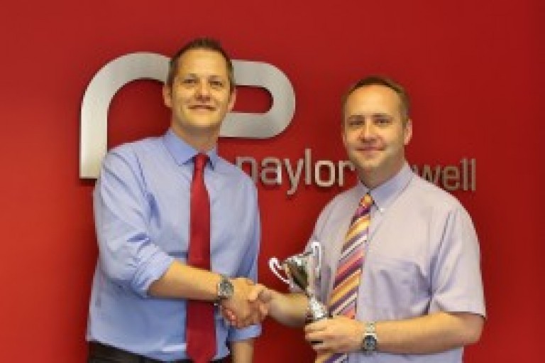 Branch Manager collects Customer Service Award